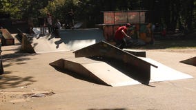 Teens practicing skateboard