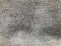 Tekstura czarna szara stara obdrapana betonowa ściana z kawałkami stara podława exfoliated farba z pęknięciami, żyły fotografia stock Tekstura czarna szara stara obdrapana betonowa ściana z kawałkami stara podława exfoliated farba z pęknięciami, żyły fotografia stock