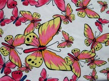 Tela blanca con las mariposas pintadas Imágenes de archivo libres de regalías Tela blanca con las mariposas pintadas Imágenes de archivo libres de regalías