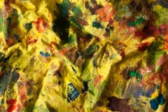 Tela manchada amarillo con la pintura foto de archivo libre de regalías Tela manchada amarillo con la pintura foto de archivo libre de regalías
