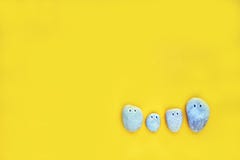 The stones family on the yellow paper stock photography The stones family on the yellow paper stock photography