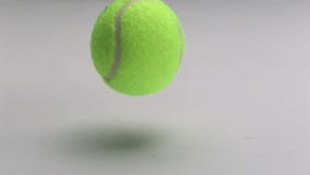Tennis ball dropping and bouncing