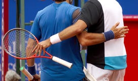 Tennis players embrace Stock Photos Tennis players embrace Stock Photos