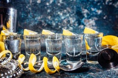 Tequila shots with lemon slices and cocktail details. Alcoholic drinks in shot glasses served in pub or bar Royalty Free Stock Photo Tequila shots with lemon slices and cocktail details. Alcoholic drinks in shot glasses served in pub or bar Royalty Free Stock Photo