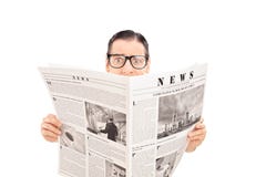 Terrified man reading a newspaper royalty free stock photography Terrified man reading a newspaper royalty free stock photography