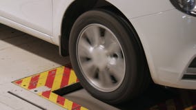 Test of quality of automobile wheel and tyre in a plant, close-up