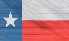 Teste padrão da bandeira de Texas na textura da placa de madeira fotografia de stock royalty free Teste padrão da bandeira de Texas na textura da placa de madeira fotografia de stock royalty free