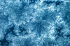 Teste padrão da tintura do laço com fundo azul abstrato Detalhe de textura do tecido de algodão imagem de stock Teste padrão da tintura do laço com fundo azul abstrato Detalhe de textura do tecido de algodão imagem de stock