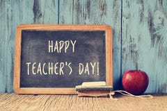 Text happy teachers day written on a chalkboard, retro effect