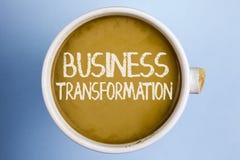 Text sign showing Business Transformation. Conceptual photo Making changes in conduction of the company Upgrade written on Coffee stock image Text sign showing Business Transformation. Conceptual photo Making changes in conduction of the company Upgrade written on Coffee stock image