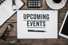 Text Upcoming Events written in notepad, Office desk with comput