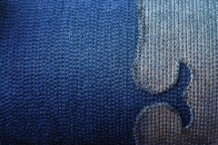 Textur av sytt bomullsjeanstyg med den dekorativa beståndsdelen Arkivbilder Textur av sytt bomullsjeanstyg med den dekorativa beståndsdelen Arkivbilder