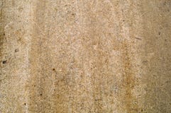 Textur av tät tamped brun sand, jord med kiselstenar på en grusväg arkivbild Textur av tät tamped brun sand, jord med kiselstenar på en grusväg arkivbild