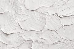 Texture abstraite décorative blanche de plâtre avec les calomnies texturisées Photographie stock Texture abstraite décorative blanche de plâtre avec les calomnies texturisées Photographie stock