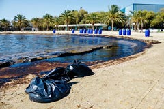 Texture of crude oil spill on sand beach from oil spill accident, Agios Kosmas bay, Athens, Greece, September 14 2017. royalty free stock photography Texture of crude oil spill on sand beach from oil spill accident, Agios Kosmas bay, Athens, Greece, September 14 2017. royalty free stock photography