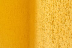Texture de fond d'un mur de relief jaune avec les bords brouillés de l'image photos stock Texture de fond d'un mur de relief jaune avec les bords brouillés de l'image photos stock