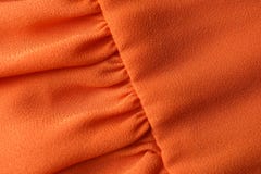 Texture de tissu orange avec des plis comme fond photo libre de droits Texture de tissu orange avec des plis comme fond photo libre de droits