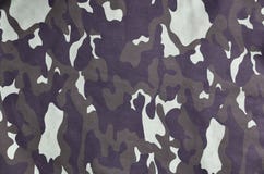 Texture of fabric with a camouflage painted in colors of the marsh. Army background image. Textile pattern of military camouflage royalty free stock images Texture of fabric with a camouflage painted in colors of the marsh. Army background image. Textile pattern of military camouflage royalty free stock images