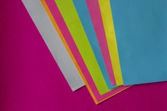 Texture of few sheets of coloured paper and fuchsia background royalty free stock images Texture of few sheets of coloured paper and fuchsia background royalty free stock images