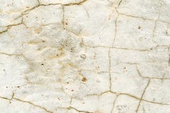 Texture of a light stone surface covered with cracks close up stock photography Texture of a light stone surface covered with cracks close up stock photography