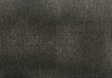 Rectangular fabric thread mesh on dark background royalty free stock image Rectangular fabric thread mesh on dark background royalty free stock image