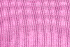 Texture of pink wool knitted fabric close up, abstract textile background royalty free stock photography Texture of pink wool knitted fabric close up, abstract textile background royalty free stock photography