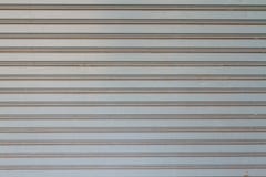 Textuur van Gray Rolling Steel Doors stock afbeelding Textuur van Gray Rolling Steel Doors stock afbeelding