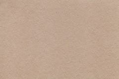 Textuur van oude beige document close-up Structuur van een dichte kleur van het kartonzand De achtergrond Stock Afbeeldingen