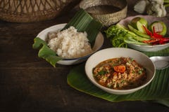Thai Northern Style Pork and Tomato Chili Relish, nam prik ong in white bowl on wood table there are side dishes of fresh royalty free stock photo Thai Northern Style Pork and Tomato Chili Relish, nam prik ong in white bowl on wood table there are side dishes of fresh royalty free stock photo