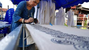 Thai women create and making batik paint and draw on fabric