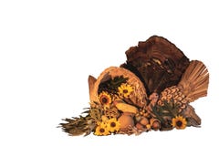Thanksgiving cornucopia centerpiece with sunflowers, turkey and turkey feathers, oak leaves, celebrating fall autumn harvest holid royalty free stock photo Thanksgiving cornucopia centerpiece with sunflowers, turkey and turkey feathers, oak leaves, celebrating fall autumn harvest holid royalty free stock photo