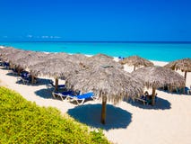 Thatched umbrellas at a beach in Cuba stock image Thatched umbrellas at a beach in Cuba stock image