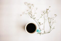 The Abstract Art Design Background Of Blue Ceramic Coffee Cup Put Beside Flower,on White Background Royalty Free Stock Photos The Abstract Art Design Background Of Blue Ceramic Coffee Cup Put Beside Flower,on White Background Royalty Free Stock Photos