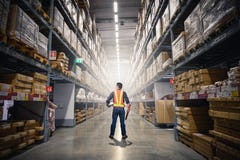 The Abstract Image Of The Engineer Standing In Front Of The Warehouse Storage. The Concept Of Engineering, Shipping, Management, W Royalty Free Stock Photo The Abstract Image Of The Engineer Standing In Front Of The Warehouse Storage. The Concept Of Engineering, Shipping, Management, W Royalty Free Stock Photo