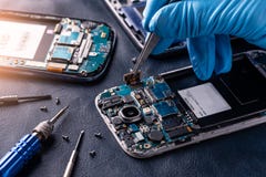 The Abstract Image Of The Technician Assembling Inside Of Smartphone By Screwdriver In The Lab. Stock Images