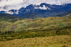 The Baliem Valley Is A High Mountain Valley At The Foot Of The Mountain Trikora Crest Royalty Free Stock Images