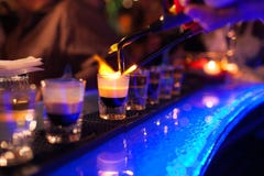 The Bartender Makes Hot Alcoholic Cocktail And Ignites Bar. Elite Night Club During Party Prepares A Fiery Cocktail Royalty Free Stock Photos