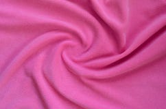 The Blanket Of Furry Pink Fleece Fabric. A Background Of Light Pink Soft Plush Fleece Material With A Lot Of Relief Fold Stock Image
