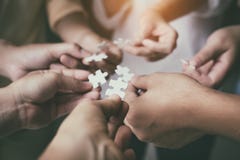 The Blurry Light Design Background Of People Hands Assembling Jigsaw Puzzle,searching For Right Match,teamwork Support Royalty Free Stock Images The Blurry Light Design Background Of People Hands Assembling Jigsaw Puzzle,searching For Right Match,teamwork Support Royalty Free Stock Images