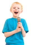 The Boy Sings With A Microphone Royalty Free Stock Photos