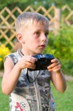 The Boy With The Camera. Royalty Free Stock Photography