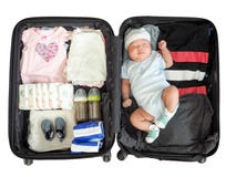 The Child Is Sleeping In A Suitcase On White Background Royalty Free Stock Photography The Child Is Sleeping In A Suitcase On White Background Royalty Free Stock Photography