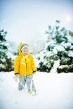 The Child On Snow Stock Photo