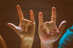 The Classic Old Film Design Background Of Human Hands In Rock And Roll Sign And Symbo Royalty Free Stock Photo The Classic Old Film Design Background Of Human Hands In Rock And Roll Sign And Symbo Royalty Free Stock Photo
