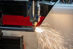 The CNC Fiber Laser Cutting Machine Cutting The Stainless Tube. Royalty Free Stock Photography