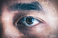 The Double Exposure Image Of The Businessman`s Eye Overlay With Futuristic Hologram. Stock Photo
