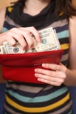 The Girl Gets Dollars From A Purse Stock Photos