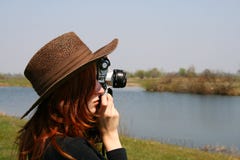 The Girl In The Hat With The Camera Stock Images