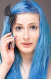 The Girl With Blue Hair With A Mobile Phone Royalty Free Stock Image