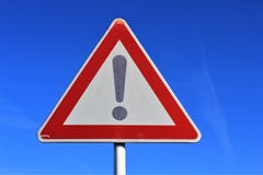 The Isolated Attention Sign With The Exclamation Mark On Blue Background Stock Photography